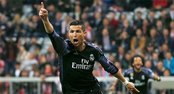 Cristiano Ronaldo is ecstatic on scoring against Bayern Munich during their Champions League quarter-final first leg match at the Allianz Arena in Munich on Wednesday