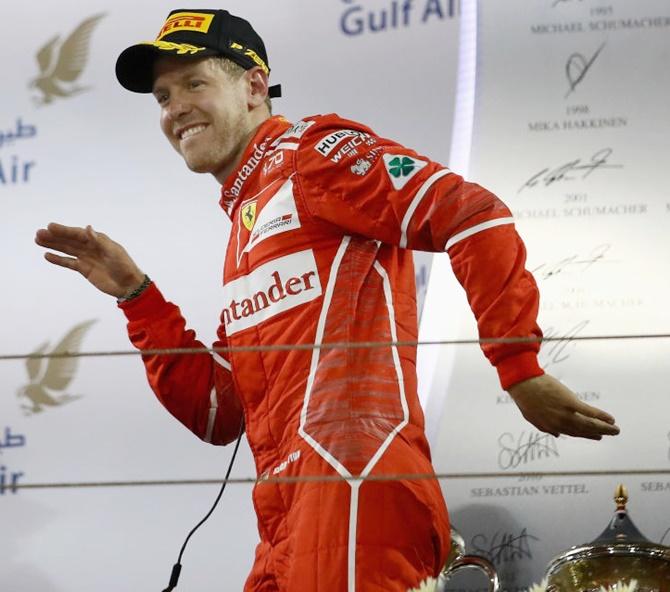 Ferrari's Sebastian Vettel celebrates