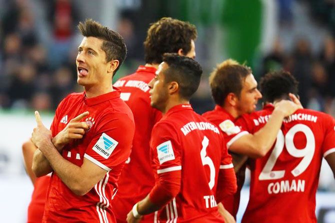 Bayern Munich's Robert Lewandowski celebrates scoring their third goal against VFL Wolfsburg during their Bundesliga match in Volkswagen Arena, Wolfsburg, Germany, on Saturday