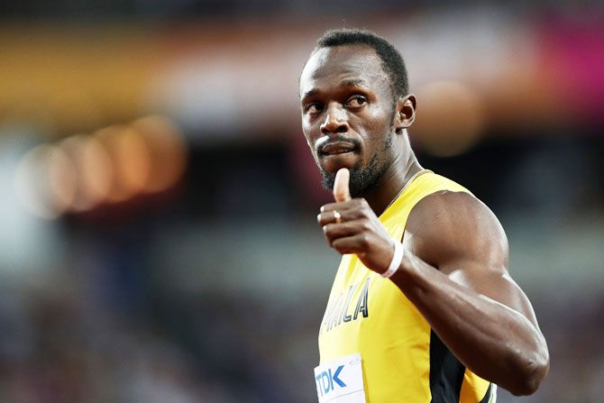 Jamaica's Usain Bolt celebrates following the Men's 100 metres heats on Friday