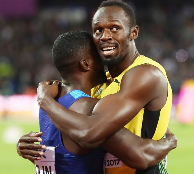 Usain Bolt of Jamaica hugs Justin Gatlin of the United States following Gatlin's win in the men's 100 metres final on Saturday
