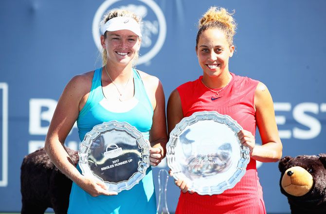 Madison Keys and CoCo Vandeweghe hold up their respective trophies after the former won West Classic final at Stanford University Taube Family Tennis Stadium in Stanford, California, on Sunday