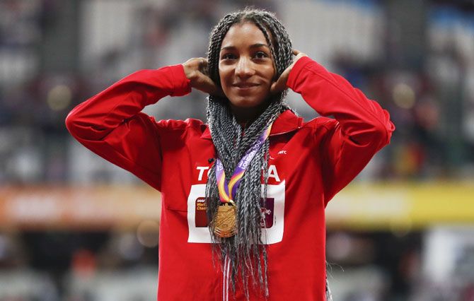 Nafissatou Thiam of Belgium (Gold) poses with the medal on the podium after winning the women’s heptathlon final on Sunday