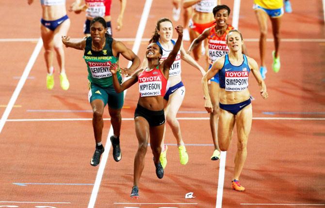 Kenya's Faith Chepngetich Kipyegon (centre) celebrates winning the Women's 1500 Metres final at the World Athletics Championships on Monday