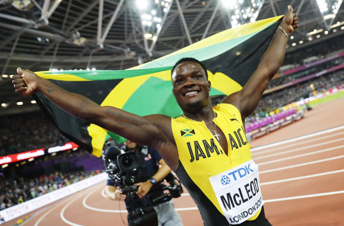 Omar McLeod of Jamaica celebrates winning the men's 110 metres hurdles final on Monday