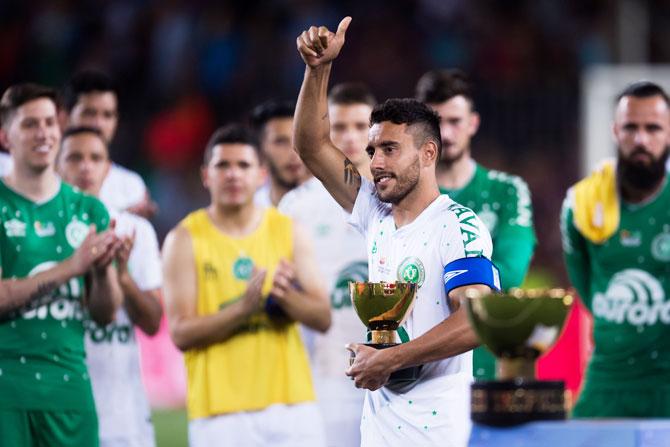 Chapecoense's Alan Ruschel holds the second place trophy after the Joan Gamper Trophy match against FC Barcelona on Monday