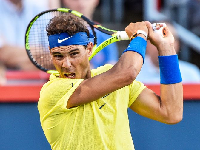 Spain's Rafael Nadal hits a return against Croatia's Borna Coric during their Rogers Cup match at Uniprix Stadium in Montreal, Quebec, Canada, on Wednesday