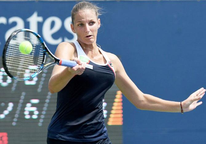 Czech Republic's Karolina Pliskova plays a shot against Japan'a Naomi Osaka during the Rogers Cup tennis tournament at Aviva Centre in Toronto, Canada