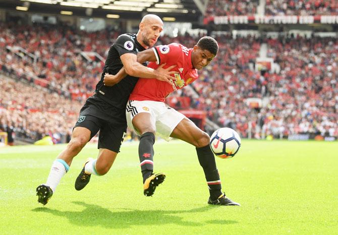 West Ham United's Pablo Zabaleta and Manchester United's Marcus Rashford battle for possession