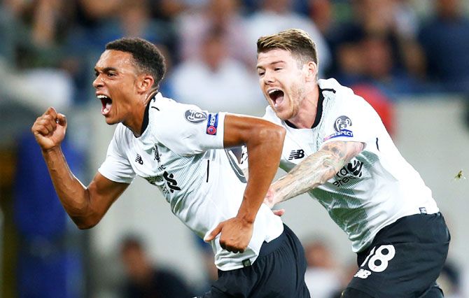 Liverpool's Trent Alexander-Arnold celebrates scoring their first goal against Hoffenheim during their qualifying play-off first leg match in Sinsheim, Germany, on Tuesday