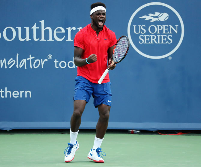 Frances Tiafoe celebrates match point after defeating Alexander Zverev