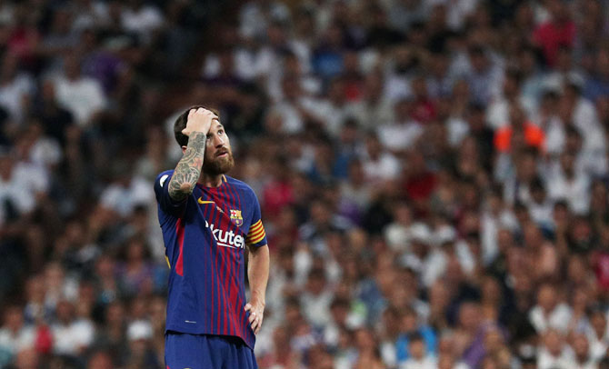 Lionel Messi cuts a dejected figure