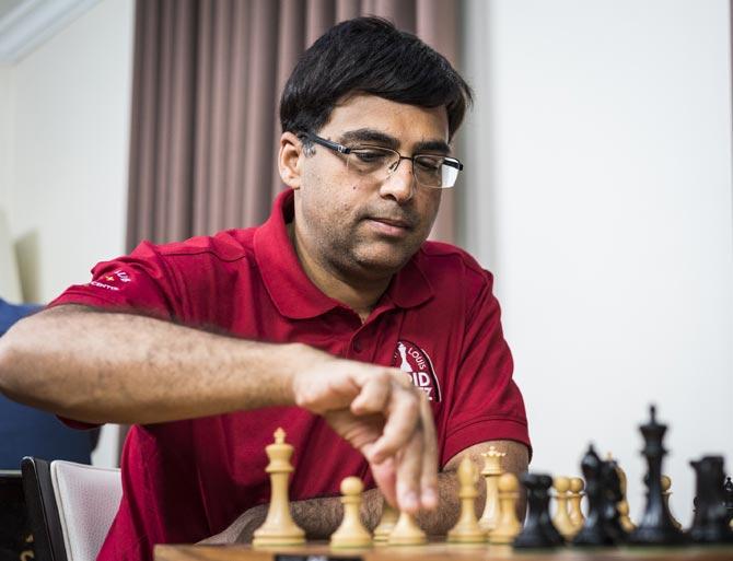 PIX: Vishy Anand celebrates International Chess Day with son - Rediff.com