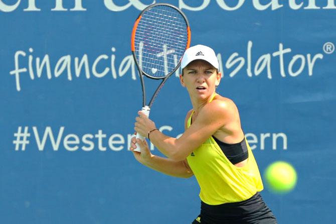 Romania's Simona Halep returns a shot against Latvia's Anastasija Sevastova