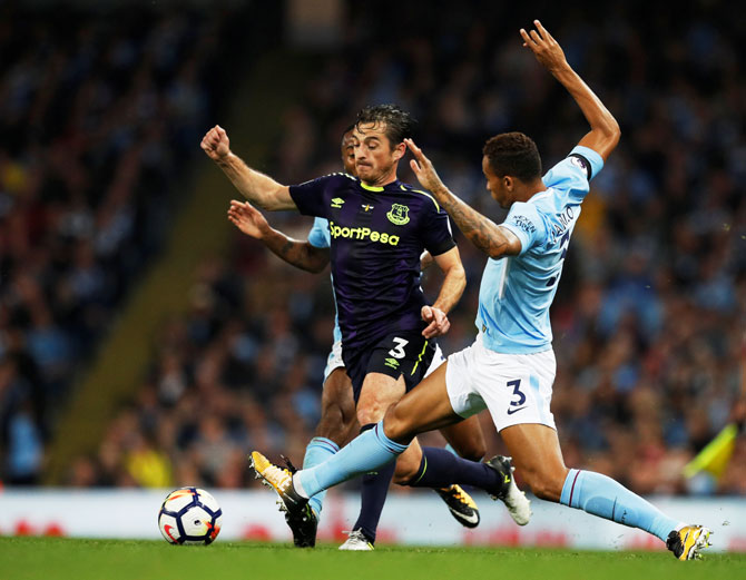 Everton's Leighton Baines challebnges Manchester City's Danilo