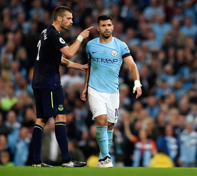 Everton's Morgan Schneiderlin and Manchester City's Sergio Aguero square up after Everton's Morgan Schneiderlin is shown the red card