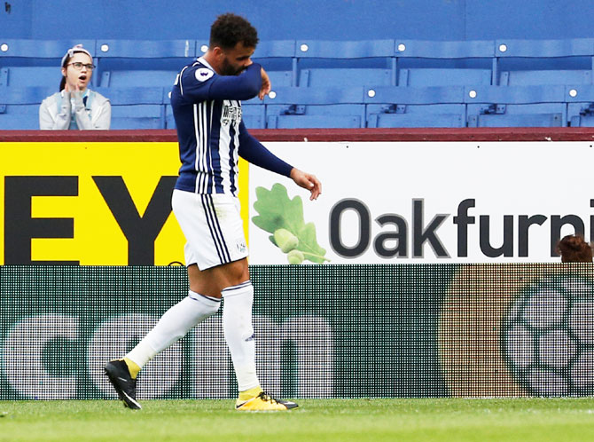  West Bromwich Albion's Hal Robson-Kanu walks off after being shown a red card by referee Martin Atkinson during their EPL match against Burnley on Saturday