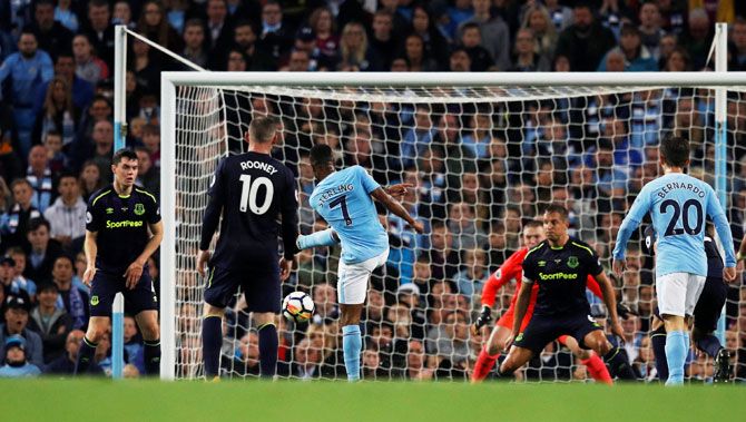 Manchester City's Raheem Sterling bangs in a breathtaking volley into the back of the net to scores the equaliser against Everton during their English Premier League match at Etihad Stadium on Monday