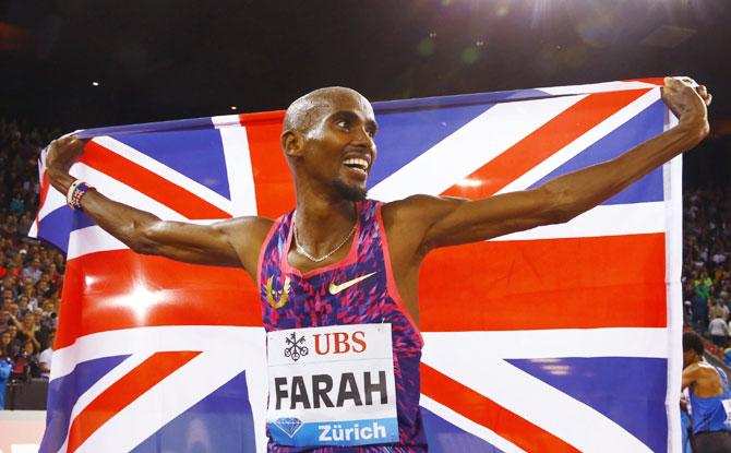 Britain's Mo Farah celebrates winning the gold medal in the men's 5000 metres run at the IAAF Athletics Diamond League in Letzigrund Stadium, Zurich on Thursday