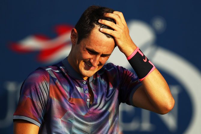Australia's Bernard Tomic reacts during his first round loss to Luxembourg's Gilles Muller on Day One of the 2017 US Open at the USTA Billie Jean King National Tennis Center in the Flushing neighborhood of the Queens borough of New York City on Monday