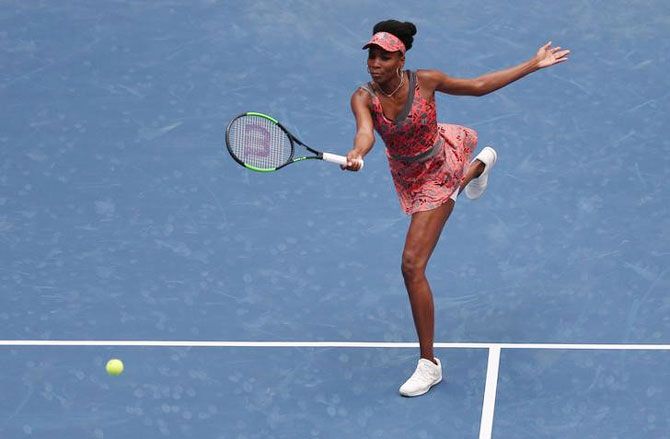Venus Williams returns a shot to Viktoria Kuzmova on day one of the US Open at USTA Billie Jean King National Tennis Center on Monday