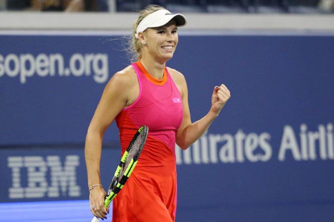 Denmark's Caroline Wozniacki celebrates after match point against Romania's Mihaela Buzemescu