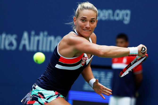 Hungary's Timea Babos in action against Maria Sharapova