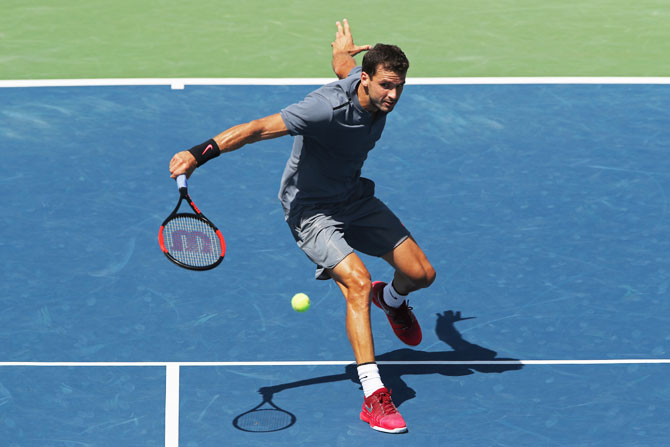 Bulgaria's Grigor Dimitrov plays a return against Czech Republic's Vaclav Safranek