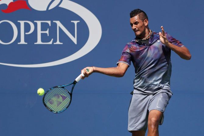 Australia's Nick Kyrgios hits a forehand during his second round match against compatriot John Millman 