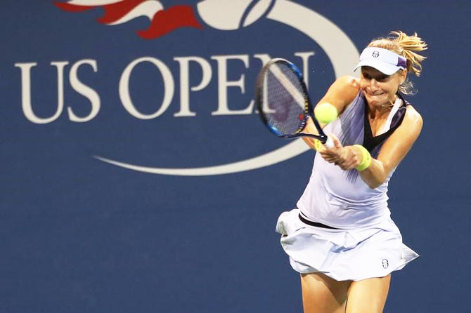 Russia's Ekaterina Makarova hits a backhand against Denmark's Caroline Wozniacki