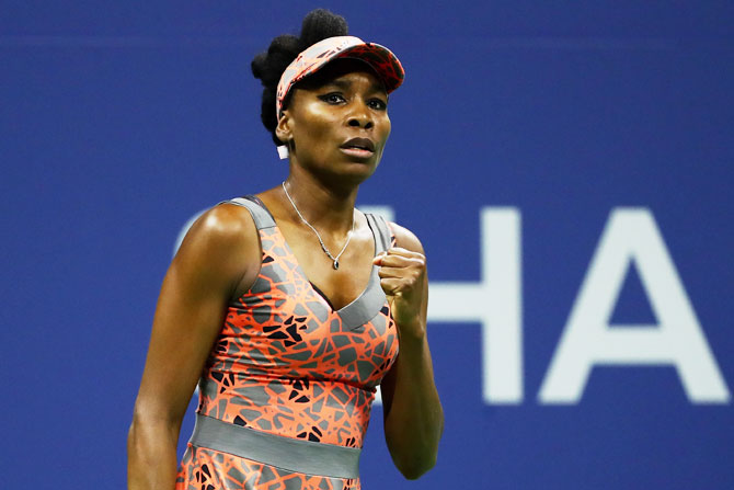 Venus Williams celebrates after defeating France's Oceane Dodin during their second round match