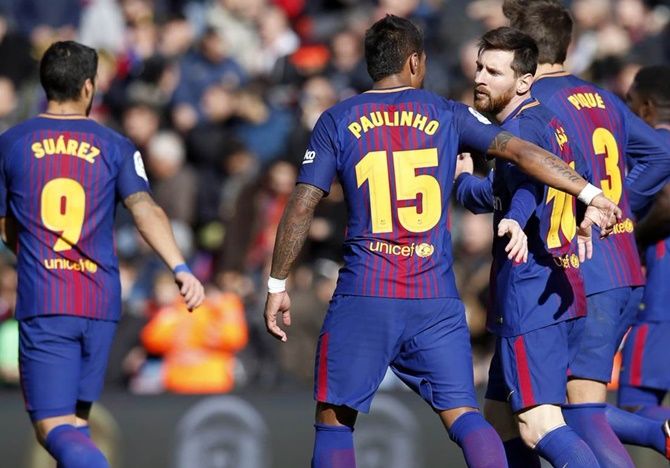 Lionel Messi, centre, celebrates with teammates