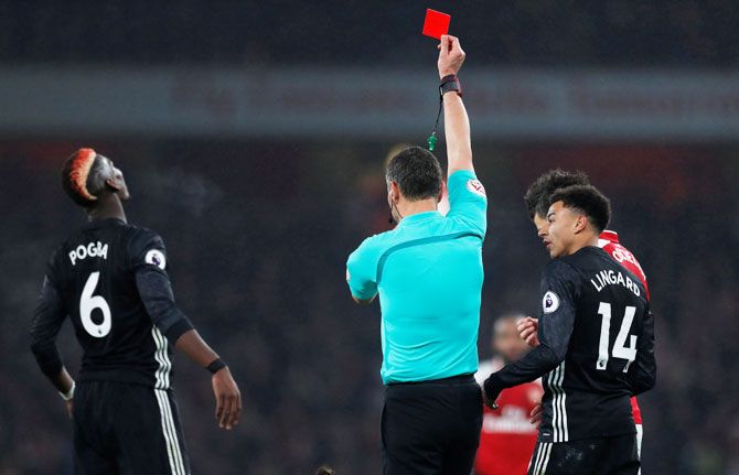 Manchester United's Paul Pogba is given the marching orders by referee Andre Marriner