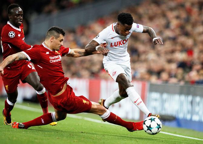 Liverpool's Dejan Lovren (left) challenges Spartak Moscow's Quincy Promes