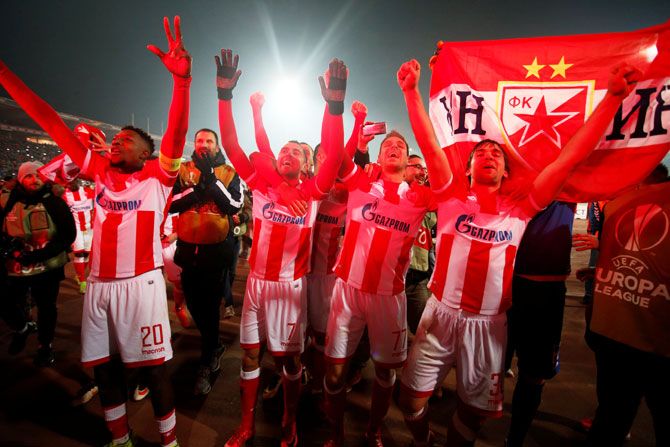Red Star Belgrade's Mitchell Donald, Nenad Krsticic, Marko Gobeljic and Filip Stojkovic celebrate at the end of the match against FC Cologne at Rajko Mitic Stadium in Belgrade on Thursday