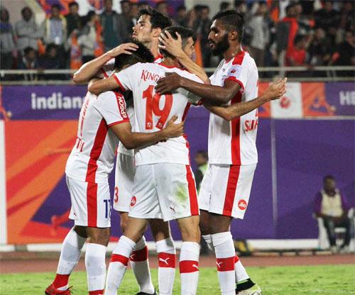 Bengaluru FC players celebrate the opening goal against Pune City FC during their ISL match at the Balewadi Stadium in Pune on Thursday