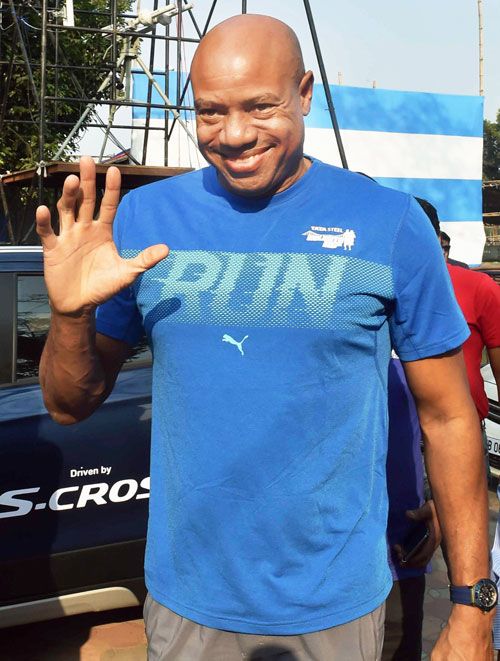 Mike Powell, former track and field athlete and long jump record holder, greets fans in Kolkata on Thursday, ahead of the Kolkata 25K run