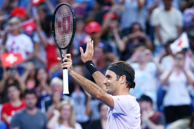 Switzerland's Roger Federer celebrates winning his 2018 Hopman Cup match against Japan's Yuichi Sugita at Perth Arena in Perth, Australia, on Sunday