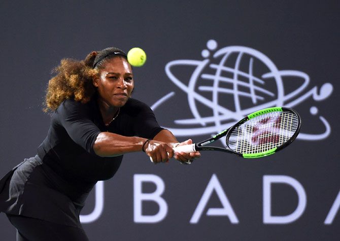 USA's Serena Williams plays a backhand during her match against Latvia's Jelena Ostapenko on Day 3 of the Mubadala World Tennis Championship at International Tennis Centre Zayed Sports City in Abu Dhabi, United Arab Emirates, on Saturday