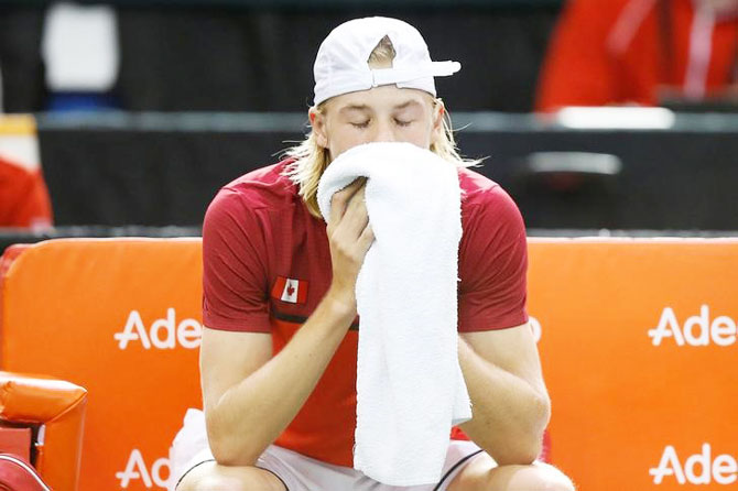 Canada's Denis Shapovalov reacts after the umpire was struck by a ball during his Davis Cup singles match against Britain's Kyle Edmund on Sunday
