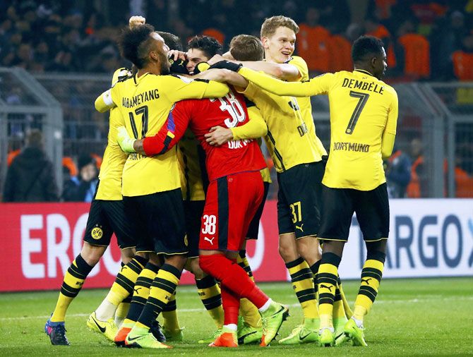 Dortmund's players celebrate after their win over Hertha Berlin in penalty shootout at Signal Iduna Park, Dortmund, on Wednesday
