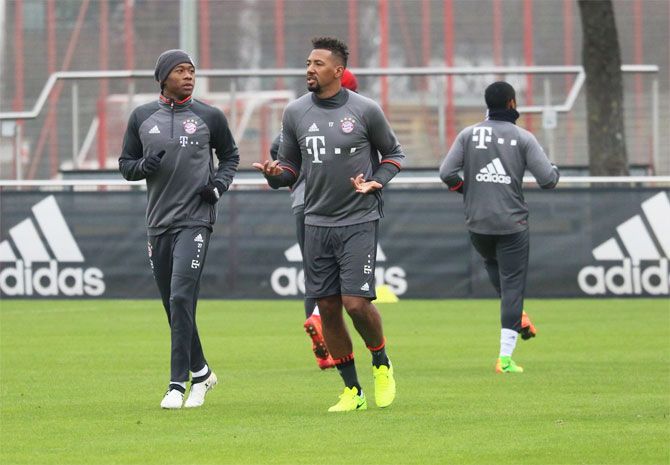 Bayern Munich's Jerome Boateng (right) and a teammate at a training session on Monday