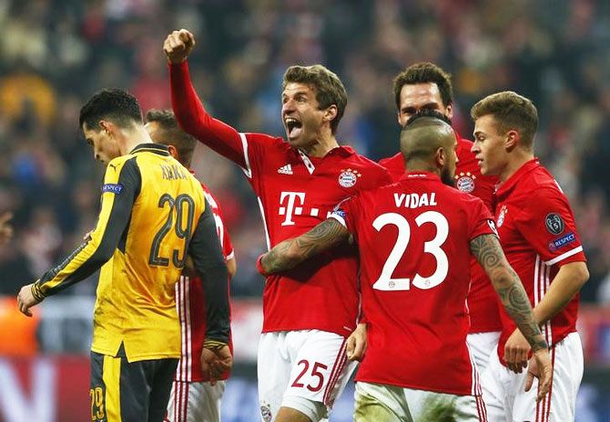 Bayern Munich's Thomas Muller celebrates scoring their fifth goal against Arsenal during their UEFA Champions League Round of 16 First Leg match at Allianz Arena in Munich on Wednesday