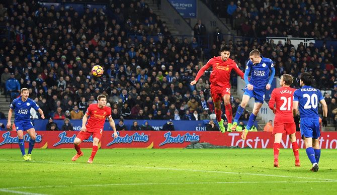 Leicester City's Jamie Vardy heads to score the club's third goal during the Premier League match against Liverpool at The King Power Stadium in Leicester on Monday