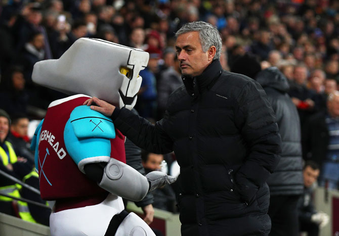 Manchester United manager Jose Mourinho walks past the West Ham mascot on Monday