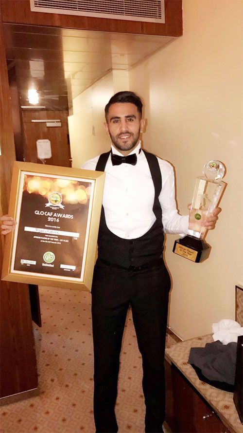Leicester City's Algerian striker Riyad Mahrez shows off his African Player of the Year Award