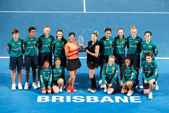 Sania Mirza and Bethanie Mattek-Sands celebrate winning the Brisbane International doubles title on Saturday