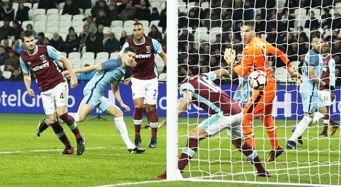 Manchester City's John Stones scores their fifth goal against West Ham United during their FA Cup 3rd round match at the London Stadium on Saturday