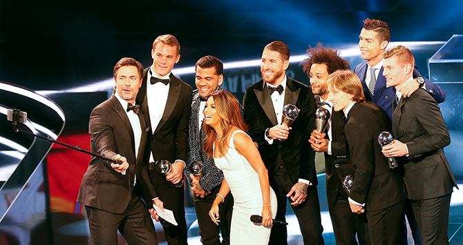 Manuel Neuer, Dani Alves, Sergio Ramos, Marcelo, Luka Modric, Toni Kroos and Cristiano Ronaldo pose with the hosts, actress Eva Longoria and German presenter Marco Schreyl. Photograph: Ruben Sprich/Reuters