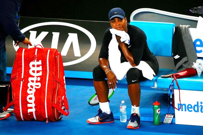 Serena Williams of the US takes a break after finishing a training session on Friday